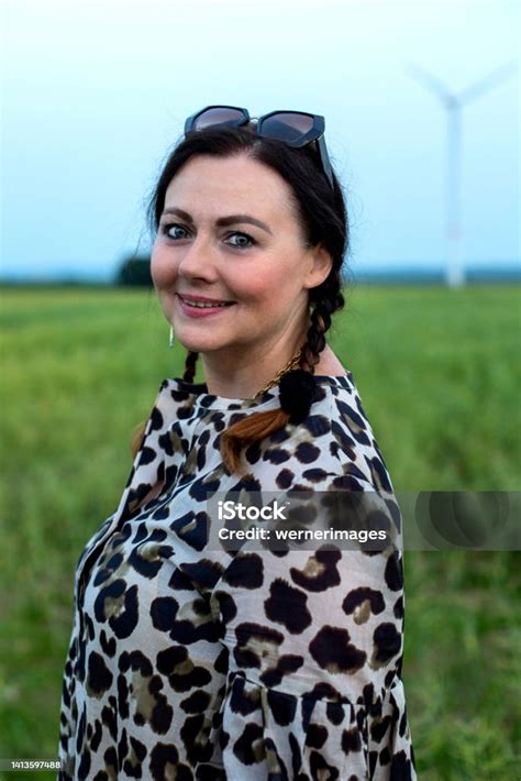 Portrait Of A Beautiful Woman In Her Fifties Outdoors Stock Photo