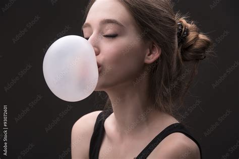 Sexual Brown Haired Girl With Bubble Of Chewing Gum Stock Photo Adobe Stock