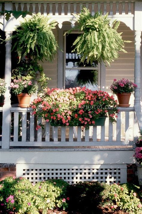 Curb Appeal Container Garden On House Front Porch With Impatiens