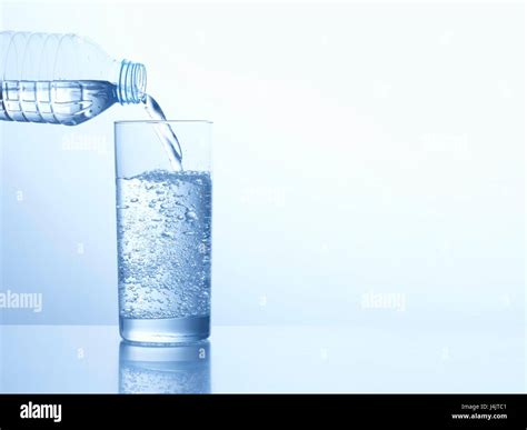 Pouring Water From Bottle Glass Hi Res Stock Photography And Images Alamy