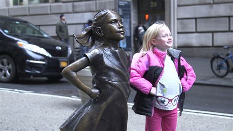 A Statue Of A Defiant Girl Now Faces The Wall Street Bull Youtube