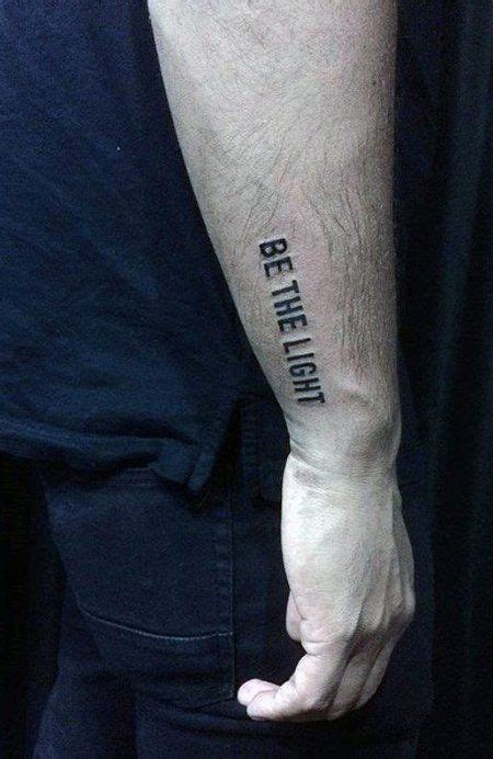 A Person With A Tattoo On Their Arm