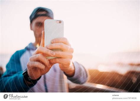 Young Adult Man Taking Photo With Smart Phone Outdoor A Royalty Free
