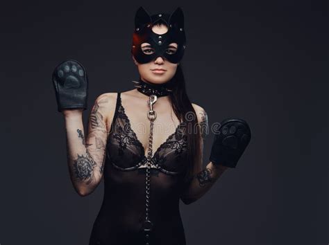 Woman Wearing Black Lingerie In Bdsm Cat Leather Mask And Accessories