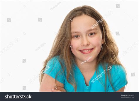 Close Up Of A 10 Year Old Girl Smiling At The Camera Stock Photo