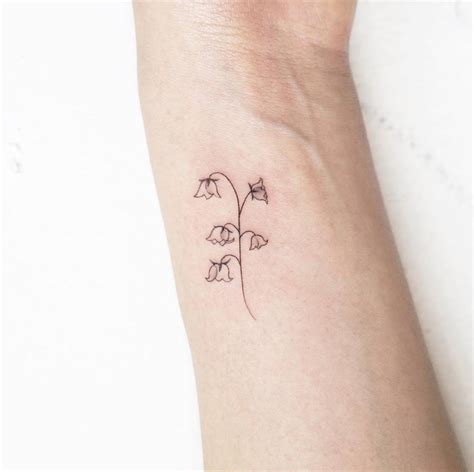 Fine Line Lily Of The Valley Tattoo Located On The