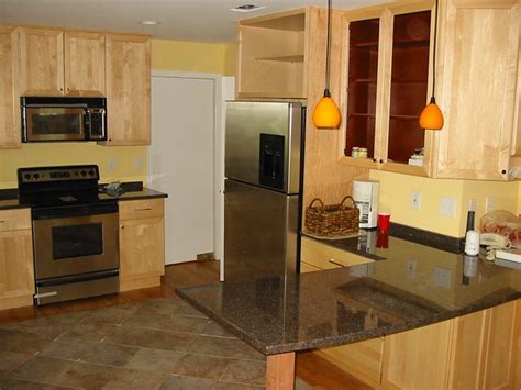 Adding two over the peninsula seemed to add more general light into the dining area and make it all a cleaner design. Kitchen with 6" Recessed lights and Pendants over ...