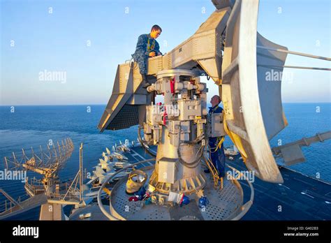Technicians Perform Maintenance On The Spn 43 Radar Aboard Uss John