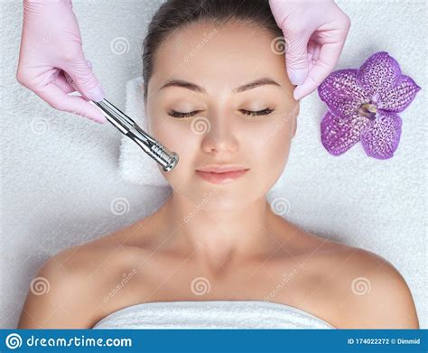 Cosmetologist Makes Procedure Of Cleansing And Moisturizing Of Skin