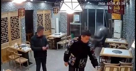 Caught On Camera Bull Barges Into Chinese Restaurant Knocks Customer Off His Feet