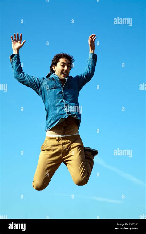 Man Jumping Skywards Stock Photo Alamy