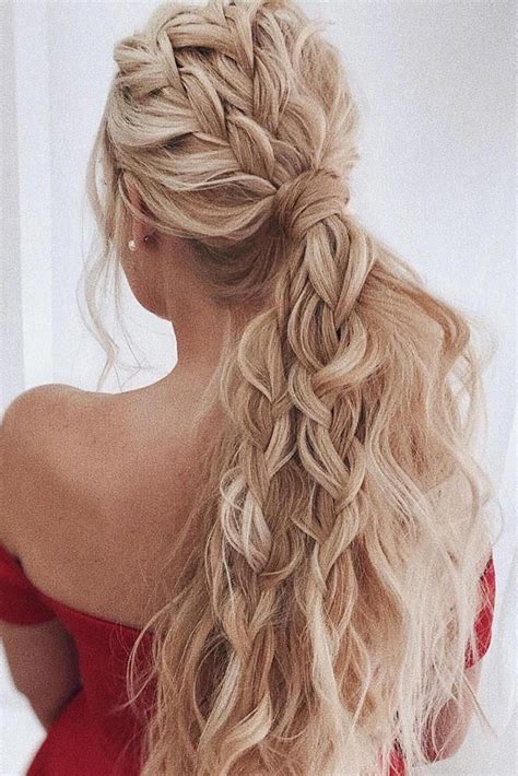 A gorgeous side swept wedding fishtail braid with an additional braided halo and a floral crown for a boho bride. wedding hairstyles for long hair beach wavy volume ...