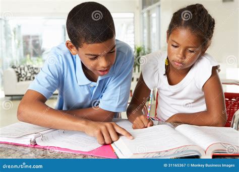 Two Children Doing Homework In Kitchen Stock Image Image Of Education