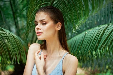 premium photo woman in blue swimsuit green leaves exotic island tropics