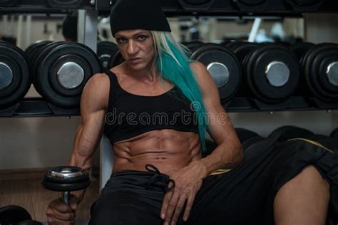 Attractive Middle Aged Woman Resting Relaxed In Gym Stock Image Image