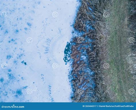Aerial View Of A Frozen Lake Ice Sheet Background Frozen Grass On The