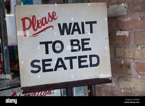 Please Wait To Be Seated Sign Stock Photo Royalty Free Image 40078449