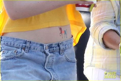Elle Fanning Bares Her Tummy Exposing A Temporary Unicorn Tattoo
