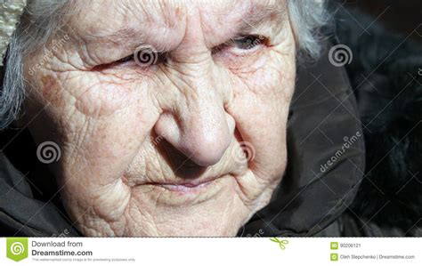 Portrait Of Old Talking Woman Serious Grandmother Sitting Outdoor And