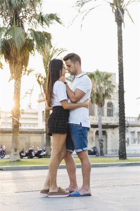 Young Urban Couple Falling In Love Kissing Stock Photo