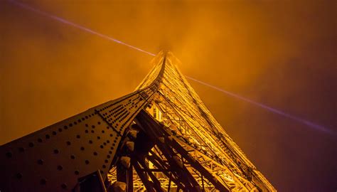 A Climber Scaled The Eiffel Tower Mountain Planet