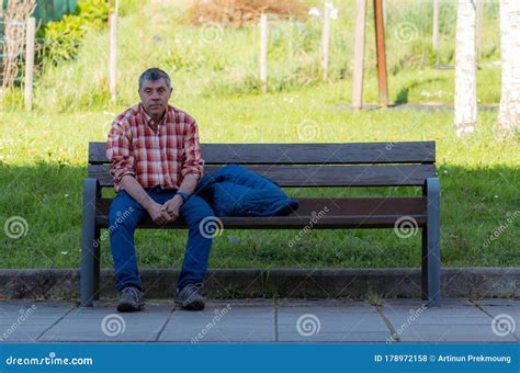 Gipuzkoa Spain March 22 2018 Sad And Tired Man Sitting On Wooden Bench In Park Old Man Wear