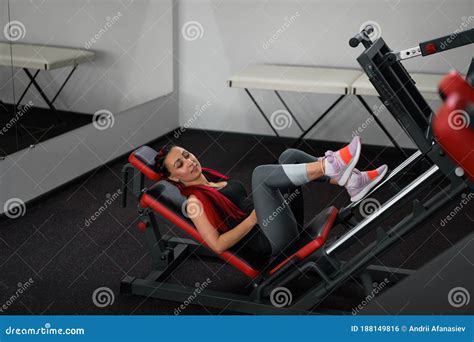 Gym Woman Leg Press Machine Training Pushing Weight Training Legs