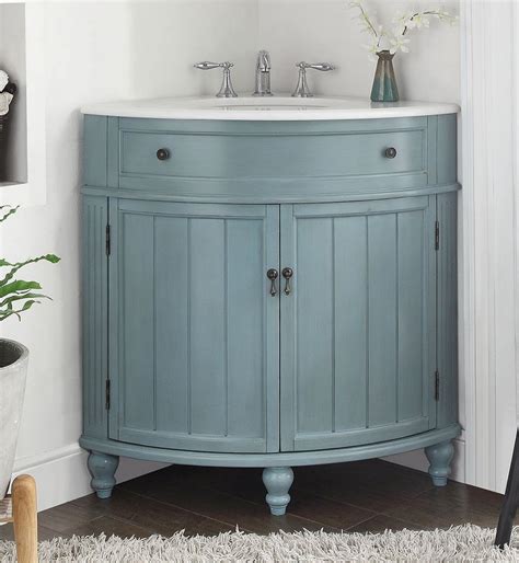 A double trough sink bathroom vanity has basins recessed directly into its countertop, making it an easy clean option. 24" Light Blue Thomasville Corner bathrrom sink Vanity # GD-47544BU - Chans Furniture - 1
