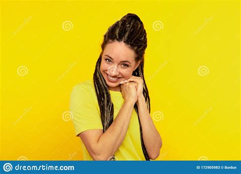 Glad Pleased Happy Young Woman In The Yellow Studio Stock Image