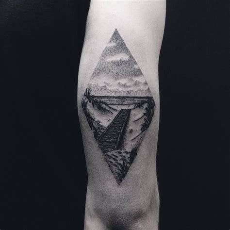 That's why tattoo artists usually put landscape tattoos inside geometric shapes such as circle, triangle, square. Dot-work style rhombus-shaped beach landscape tattoo on the back of the right upper arm ...
