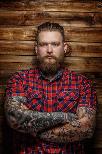 Man With Tattoos And Beard Stock Photo Download Image