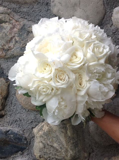 stunning hand tied bridal bouquet of white peony and roses. Classic and elegant! | Hand tied 