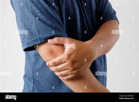 Close Up Man Guy Holding Touching Painful Elbow Pain Relief Concept