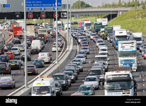 Traffic Congestion Cars And Trucks Travelling In Both Directions On M25