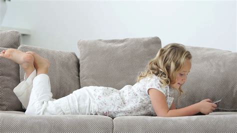 Relaxed Person Using Tablet On Sofa Stock Footage Sbv
