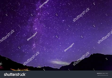 Purple Night Sky Stars And Milky Way Over Mountains Stock