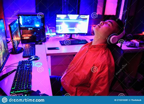 Asian Gamer Playing Online Game On Pc In Dark Room Tired Gamer Sleep