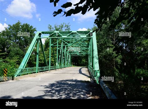 Old Steel Howe Truss Style Bridge Over A River In Central Indiana Stock