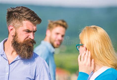 husband strictly watching his wife looking at another guy while walk jealous concept passerby
