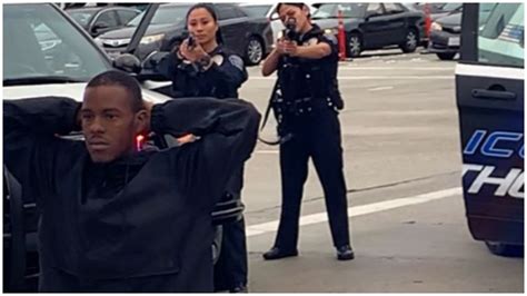Several Hawthorne Ca Police Officers Hold An Unarmed Black Man At