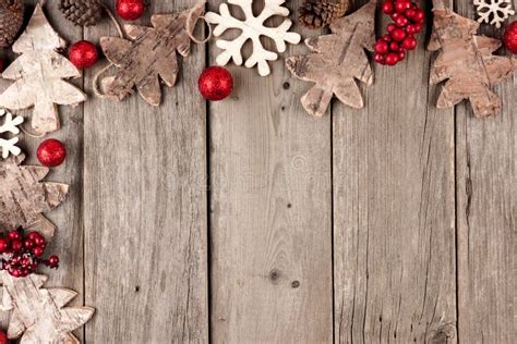 Christmas Corner Border With Rustic Wood Ornaments And Berries On Aged