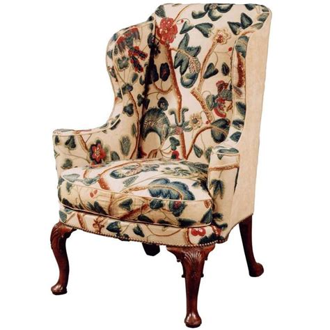 An Upholstered Chair With Floral Fabric On It