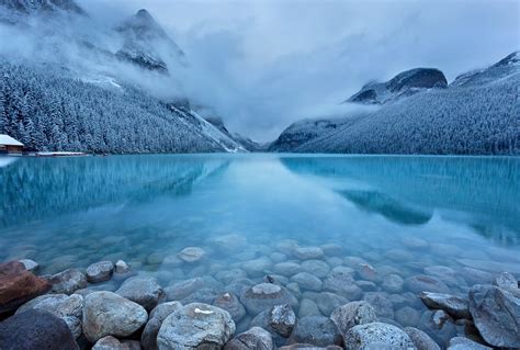 Landscape Photography Of Gray Stone In Body Of Water During Cloudy