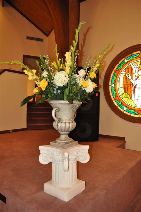 Altar flowers don't have to be a perfect balance of flowers. Altar arrangement at chruch for wedding | Altar ...