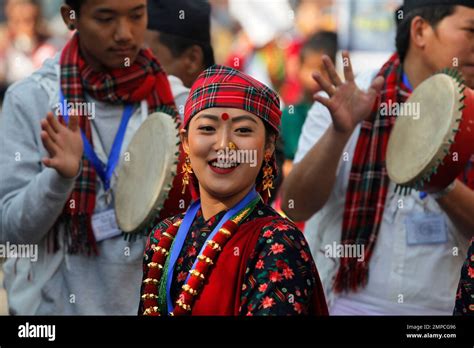 nepalese gurung community men and women wear traditional attire as they dance at a parade to