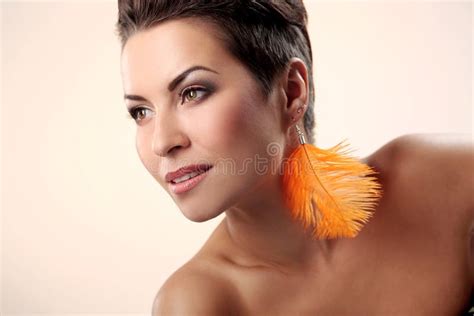 Glamour And Gorgeous Brunette With Feather Earring Stock Image Image