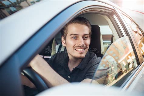 Close Up Side Portrait Of Happy Caucasian Man Driving Car Stock Image