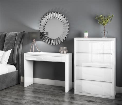 At the top two shelves for decorations are available for free placement and two columns to be placed on the sides that provide a drawer, space for decorations and a top surface with. Lexi White High Gloss Bedroom Furniture | Chest of drawers ...