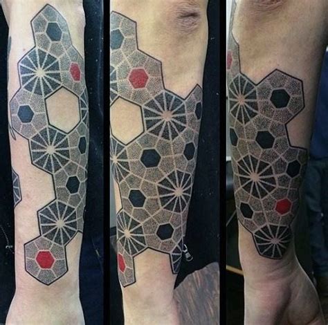 Male With Red And Black Centered Honeycomb Network Tattoo On Forearms