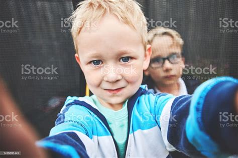 Little Brothers Bonding Taking A Selfie While Smiling Outside Two Young